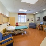 Typical Patient Room – Over 300 sq. ft. Divided Into Three Zones: The Family Zone, The Patient Zone, And The Nursing Zone. Designed To Allow Family Members To Stay Overnight With The Patient, And Still Allow The Nursing Staff Enough Dedicated Space To Move Around and Take Care Of The Patient Efficiently.